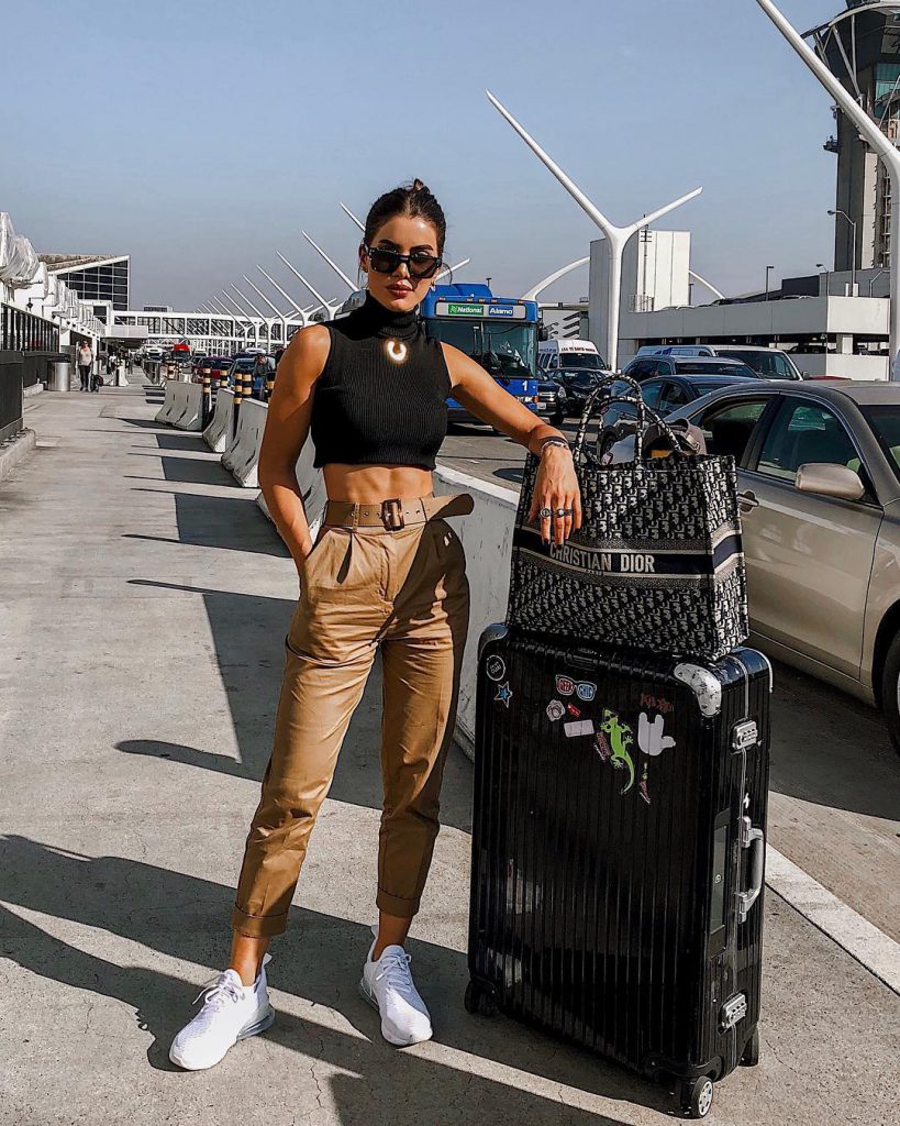 Camila Coelho With suitcases outside airport