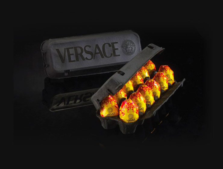 Photo of dozen eggs in black Versace packaging by Peddy