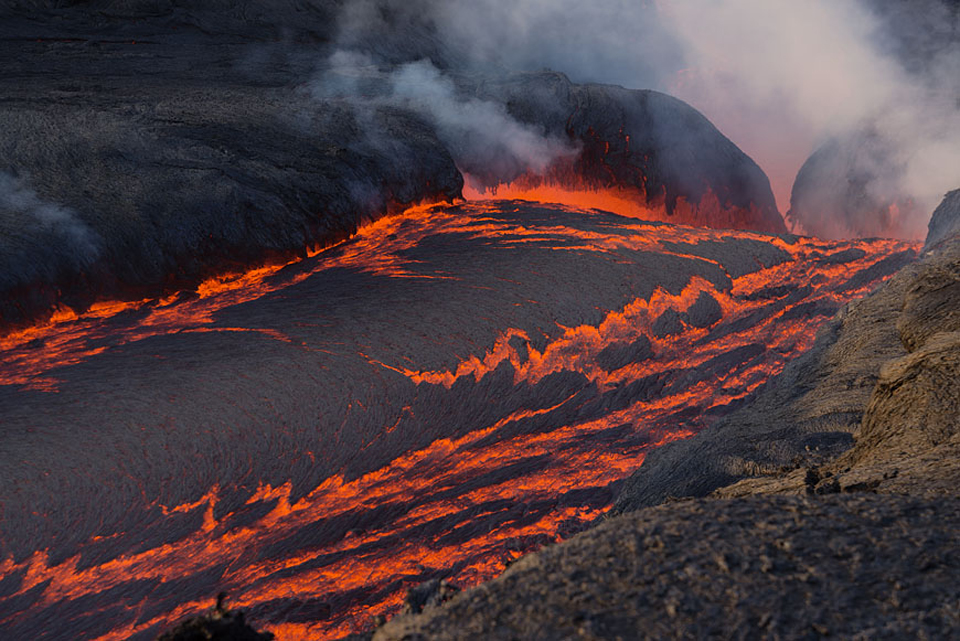 A cascade of lava flows from a fissure vent at Fogo during 30 November-3 December 2014. Photo copyright by Martin Rietze